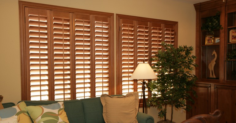 Natural wood shutters in Hartford living room.